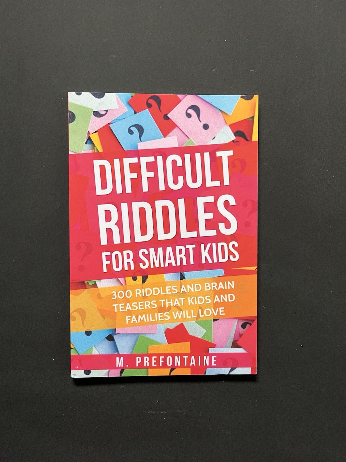 DIFFICULT RIDDLES FOR SMART KIDS Paperback Book by M. Prefontaine EUC